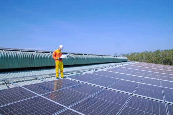 Commercial roof maintenance inspection on an industrial building